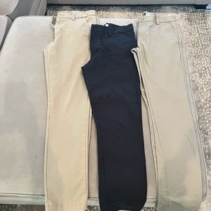 3 pair of Izod slim fit pants. Size 30x32. 2 khaki pair & 1 navy blue pair.
